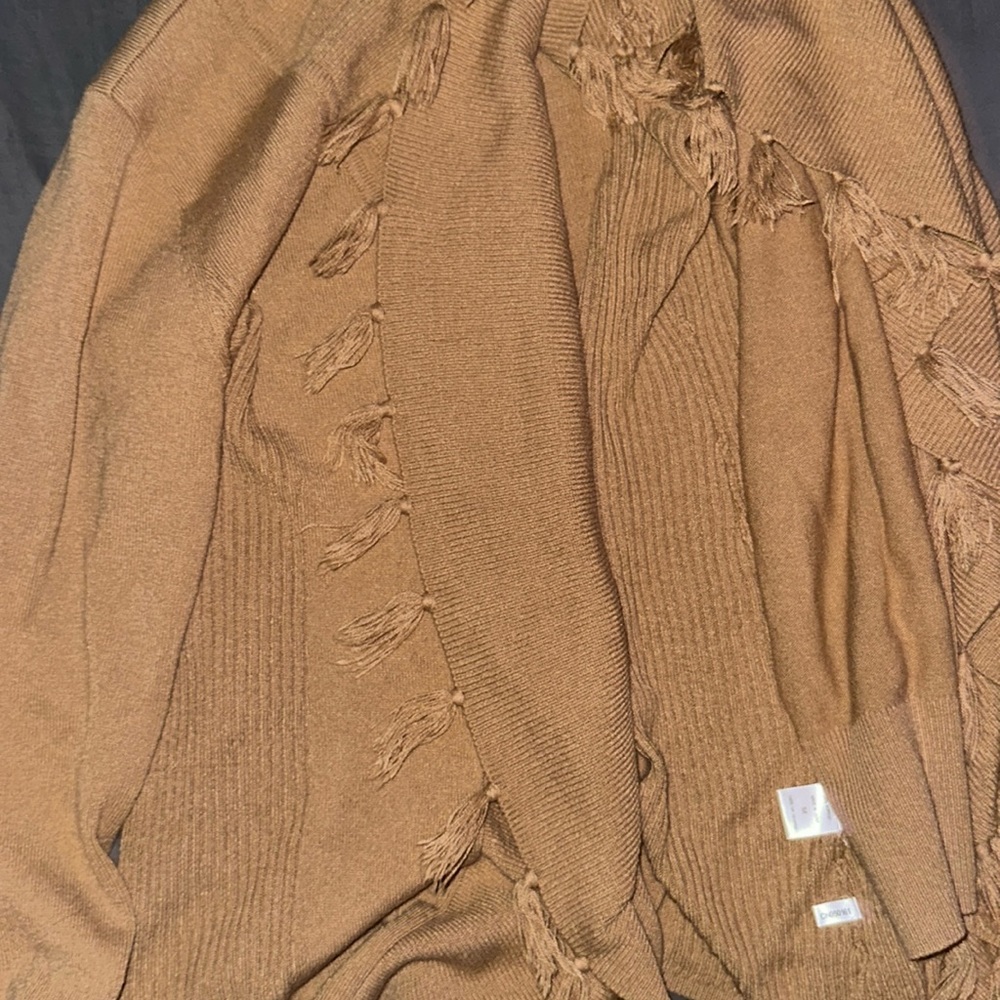 It’s a cardigan in the color that is almost tan